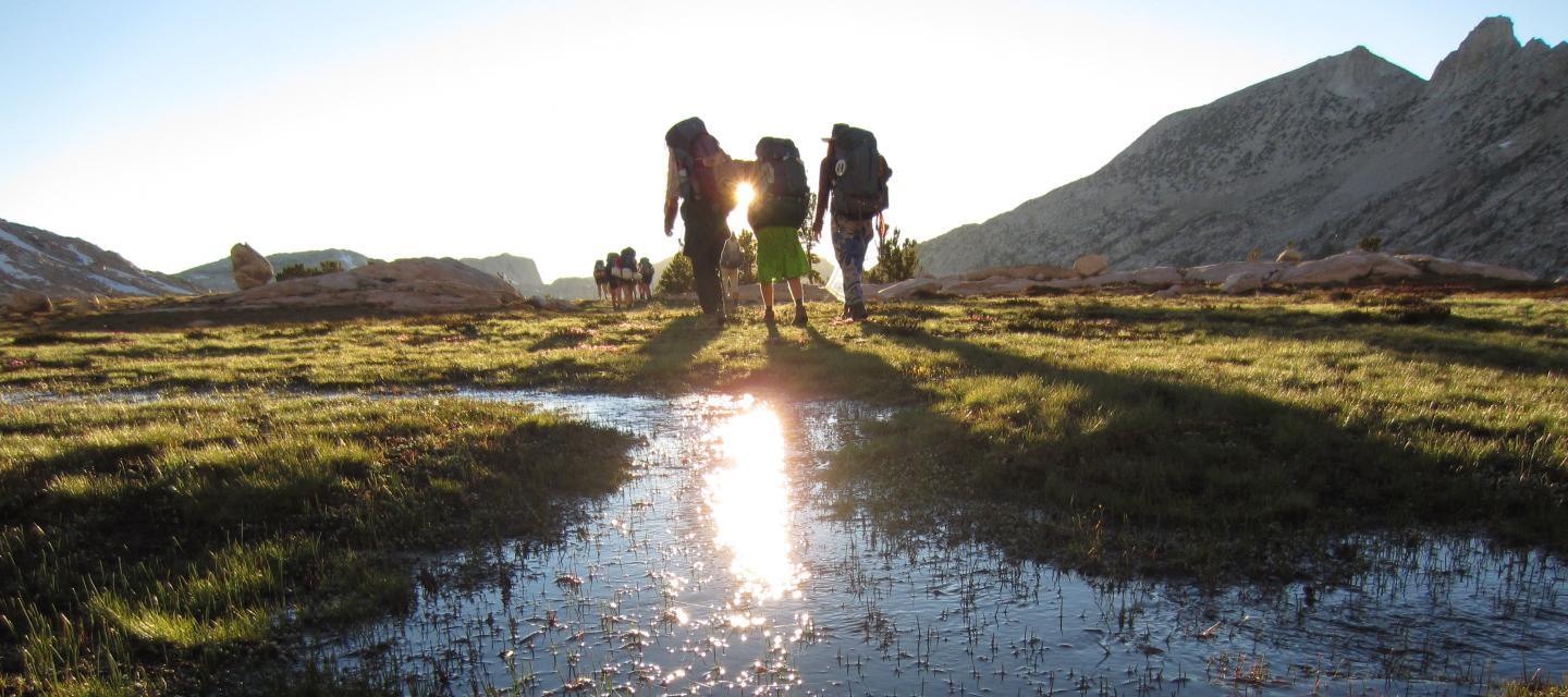 Students hike toward the sunset in Yosemite National Park